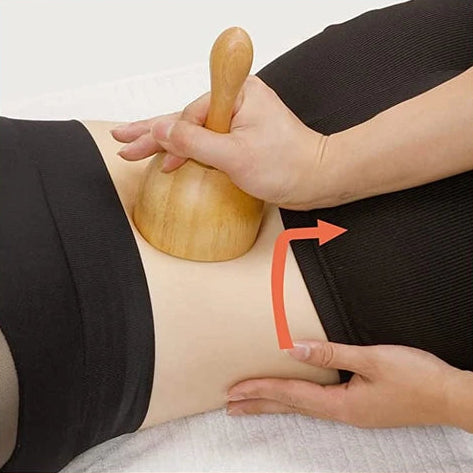 Wooden massage tool being used on different parts of the body.